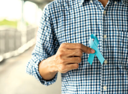 person holding blue ribbon