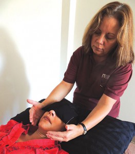 Pamela Potenzo practices healing touch on staff at  Desert Regional Medical Center