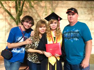 Crystal Harrell and family at her College of the Desert graduation after being diagnosed and put on the right medication.