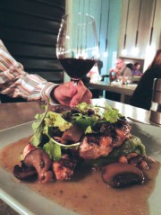 Brick chicken and arugula complimented by a Nebbiolo Italian red wine