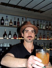 Gregory serves up The Higgins: amber rum, cinnamon infused Italian vermouth, local honey and fresh orange juice
