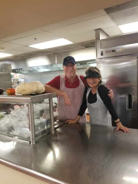 A couple suits up to prep in Martha’s Kitchen.