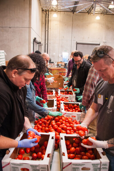 Groups lend a hand at FIND Food Bank.